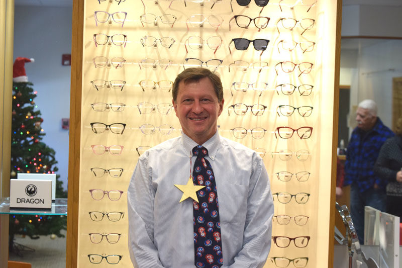 Dr. John McCormick, of Coastal Family Eye Care, stands in the Damariscotta practice on his last day of work before retirement on Tuesday, Dec. 16. McCormick, who worked at the practice for 35 years, said one of the biggest highlights of his career was being able to give back to the community. (Christina Wallace photo)