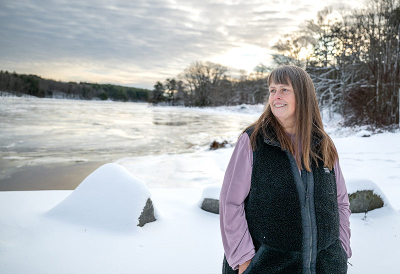 Rebecca Smith Waddell looks toward the heart of Waldoboro from the Pine Street Landing in Waldoboro. Smith Waddell has been an administrator for the 8,000-plus member Whats New in Waldoboro Facebook group since 2022. (Bisi Cameron Yee photo)