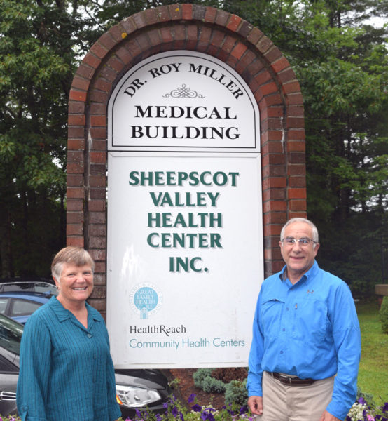 Lisa and Dr. Roy Miller stand next to the sign for the Dr. Roy Miller Medical Building in Coopers Mills in August 2019. The Sheepscot Valley Health Center Board of Directors renamed the building in Roy MiIler's honor following his retirement from full-time practice in January 2019. (LCN file)