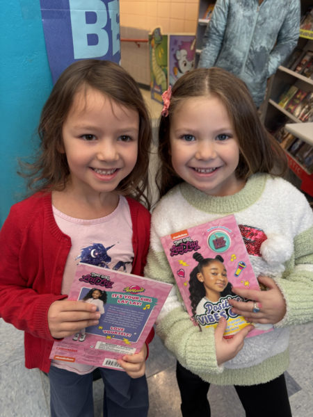 Nobleboro Central School students are all smiles while holding the free books they got from the Scholastic Book Fair, courtesy of the Nobleboro Parent-Teacher Organization. (Photo courtesy Nobleboro Central School)
