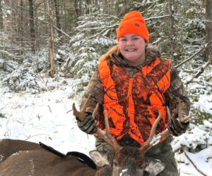 Helen Rice, 15, of Walpole, holds the antlers of the eight-point buck she shot on Wednesday, Dec. 3 during the muzzleloader season. The buck completed her Maine big game grand slam. (Courtesy photo)