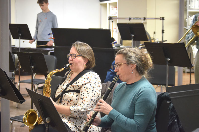 Lincoln Academy staff members Brenda Sawyer (left) and Hilary Peterson play their instruments during the first Shuck Town Pep Band rehearsal on Tuesday, Jan. 6. The band is made up of students, Lincoln Academy staff and parents, and members of the community. (Christina Wallace photo)