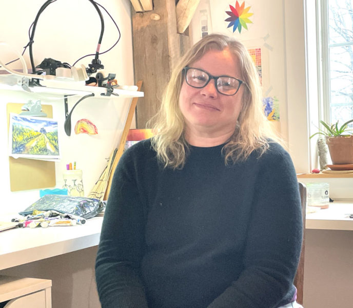 South Bristol freelance artist and educator Erica Qualey sits in her home studio in Walpole, from where she leads online classes for students all over the world. Qualey, who has been teaching art lessons since she was a teenager, said she might not be teaching online as actively as she is today without the circumstances created by the COVID-19 pandemic in 2020. (Sherwood Olin photo)