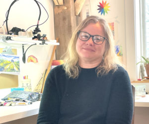 South Bristol freelance artist and educator Erica Qualey sits in her home studio in Walpole, from where she leads online classes for students all over the world. Qualey, who has been teaching art lessons since she was a teenager, said she might not be teaching online as actively as she is today without the circumstances created by the COVID-19 pandemic in 2020. (Sherwood Olin photo)