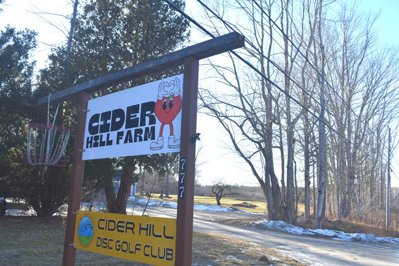 A disc golf basket hangs from the sign for Cider Hill Farm Taproom and Disc Golf Club, at 785 Main St. in Waldoboro, on Friday, Jan. 16. (Claire Taylor photo)