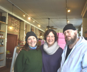 Stacy Linehan (left), former owner of Treats in Wiscasset, poses with new owners Emily Hughes and Joseph Swifka on Thursday, Jan. 8. Linehan said she hoped the sale would be an opportunity for the community to embrace change and be open to a new, fresh growth in this business." (Claire Taylor photo)