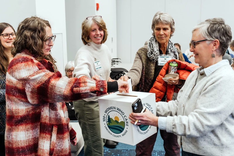Members of 100+ Women Who Care Lincoln County cast their votes during the Jan. 6 meeting at Bigelow Laboratory for Ocean Science in Boothbay. (Photo courtesy Melissa Keyser)
