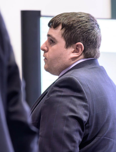 Tyler Witham-Jordan stands during a brief afternoon break at the Sagadahoc County Courthouse in Bath on Tuesday, Feb. 17. Witham-Jordan is accused of depraved indifference murder in the death of 3-year-old Makinzlee Handrahan.  (Bisi Cameron Yee photo)