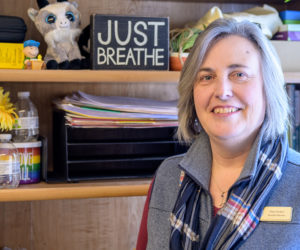 Char Corbett stands for a photo by a bookcase in her office at Healthy Kids in Newcastle on Feb. 9. I have reminders (for) when things start getting to me, she said. I just remember to breathe. (Bisi Cameron Yee photo)