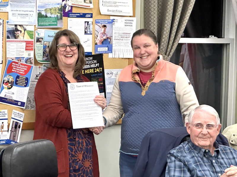 Friends of Wiscasset Public Library President Tracey Whitney (left) shakes hands with Wiscasset Select Board Chair Sarah Whitfield during the boards Tuesday, Feb. 17 meeting at which the organization was recognized. The Friends of Wiscasset Public Library is celebrating its 60th anniversary this year. (Photo courtesy Tracey Whitney)