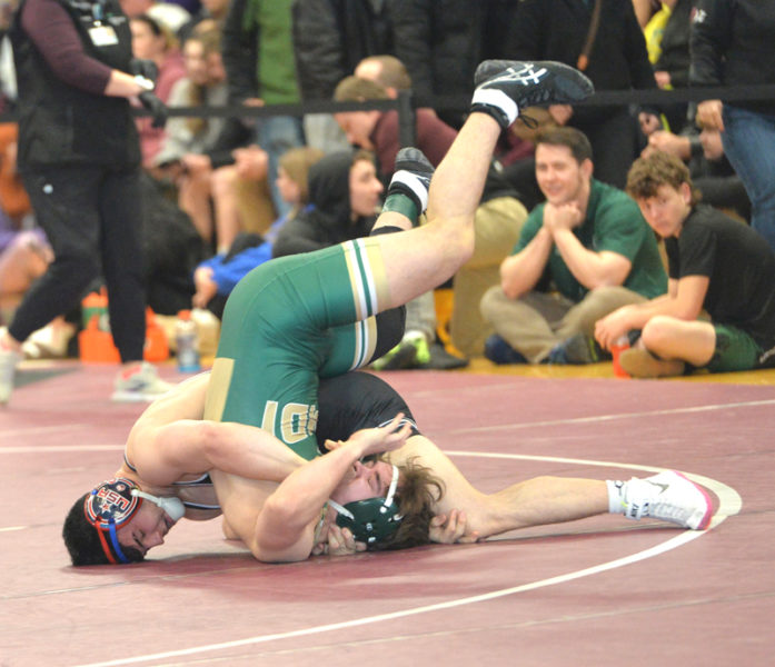 Lincoln Academy wrestler Jakobi Hagar pins Svante Anastasia, of MDI. Hagar won his third Class B wrestling state championship on Saturday, Feb. 14 at Mattanawcook Academy in Lincoln. (Paula Roberts photo)