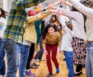 Maari Glendenning (center) goes through the bridge while her dance partner Grace Walker (far left) takes the outside during a contra dance at the Damariscotta Baptist Church on Jan. 9. The series of community contra dances in Damariscotta and New Harbor are welcoming of all ages and abilities. (Bisi Cameron Yee photo)