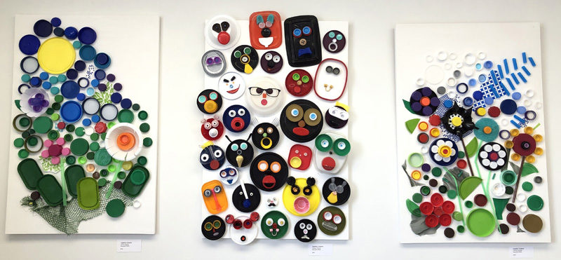 Plastic faces smile and plastic flowers bloom in Heather Greenes series of multimedia assemblages commentating on the prevalence of single-use, permanent plastics. Greenes work is featured in the March show in River Arts' River Room in Damariscotta. (Sarah Masters photo)