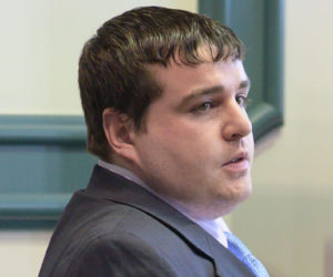 Tyler Witham-Jordan stands at the defendants table at the Sagadahoc County Superior Court in Bath on Feb. 26. Witham-Jordan was found guilty for depraved indifference murder on Tuesday, March 3 and awaits sentencing. (Bisi Cameron Yee photo)