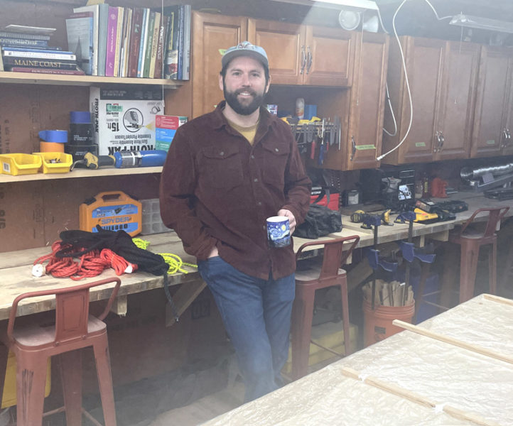 Ben Fearn stands in the workshop in his Damariscotta home. When Ben and Katie Fearn bought their house, it needed some renovation work, but it was in great location and offered plenty of room for a workshop to support Ben's contracting business and space for a growing family. (Sherwood Olin photo)