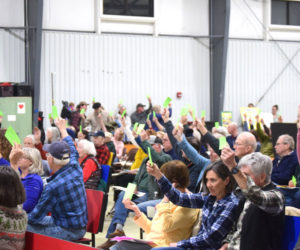 South Bristol residents vote to reject proposed amendments to the aquaculture ordinance at the annual town meeting on Tuesday, March 10. Over a dozen people spoke about the article before it was overwhelmingly defeated by a vote of 109-38. (Christina Brown photo)