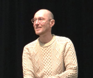 Jeff Wiseman, the new executive director of The Waldo Theatre, rolls up his sleeves as listens to a theater staff member in Waldoboro on Friday, March 7. Wiseman, who hails from a performing arts and development background in New York and Maryland, said he is looking forward to leading through listening as the theater rockets toward its 90th anniversary in December. (Sarah Masters photo)