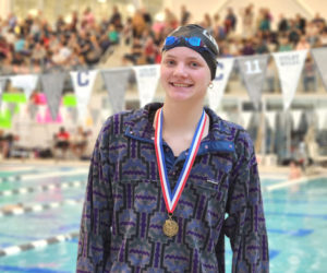 Charley Carleton wears one of the two gold medals she won at the Class B state swimming championships on Saturday, March 7. Carleton, a Lincoln Academy sophomore, won the 50 and 100 at the state meet. (Courtesy photo)