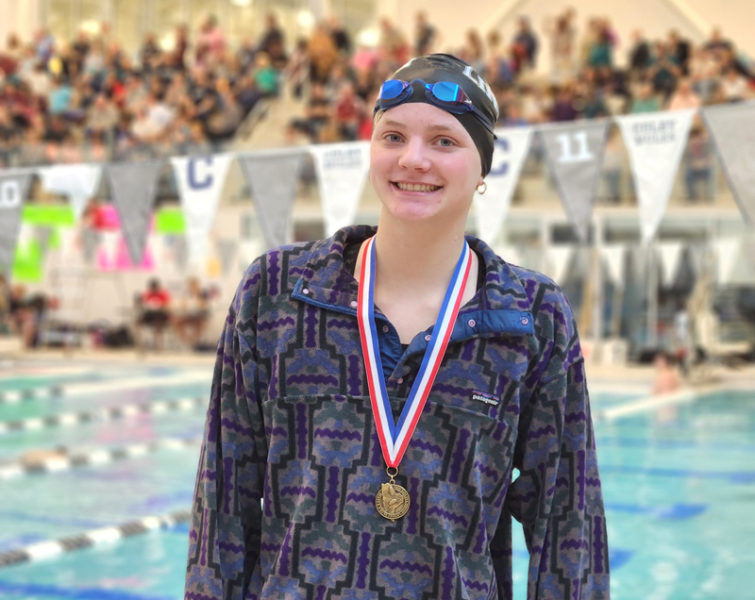 Charley Carleton wears one of the two gold medals she won at the Class B state swimming championships on Saturday, March 7. Carleton, a Lincoln Academy sophomore, won the 50 and 100 at the state meet. (Courtesy photo)