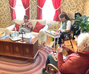 Inn Along the Way visitors work on slow stitching. (Photo courtesy Sherry Flint)