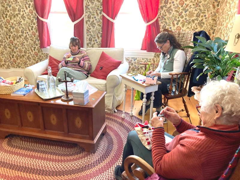 Inn Along the Way visitors work on slow stitching. (Photo courtesy Sherry Flint)
