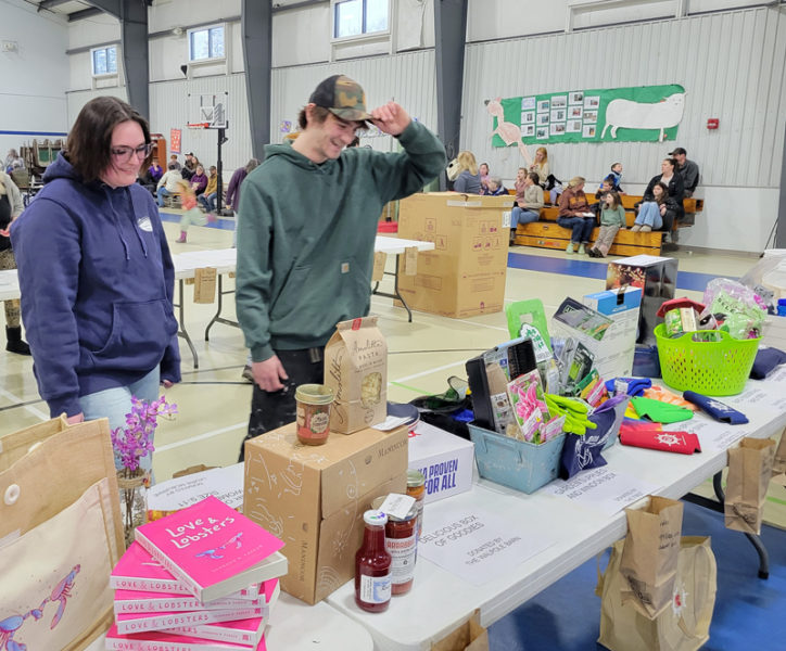 Patrons look over a few of the Tricky Tray raffle items at a previous fundraiser. (Photo courtesy Tenley Seiders)