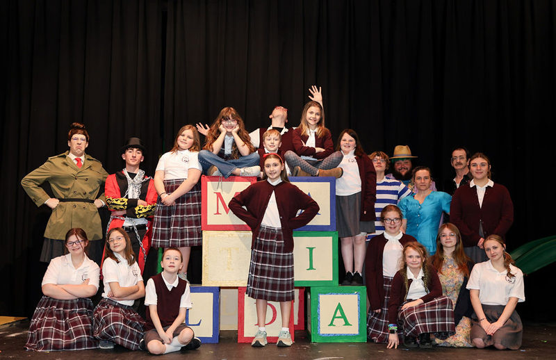 The cast of "Matilda: The Musical" features Annalise Gapski as Matilda Wormwood, Joseph Lugosch as Miss Agatha Trunchbull, and Isabella Dyke as Miss Honey. The production opens for three performances at Wiscasset Middle High School on Friday, April 17. (Photo courtesy Wiscasset Schools)