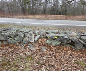 The before picture of the stone wall at the Chamberlain Cemetery. (Photo courtesy Lori Crook)