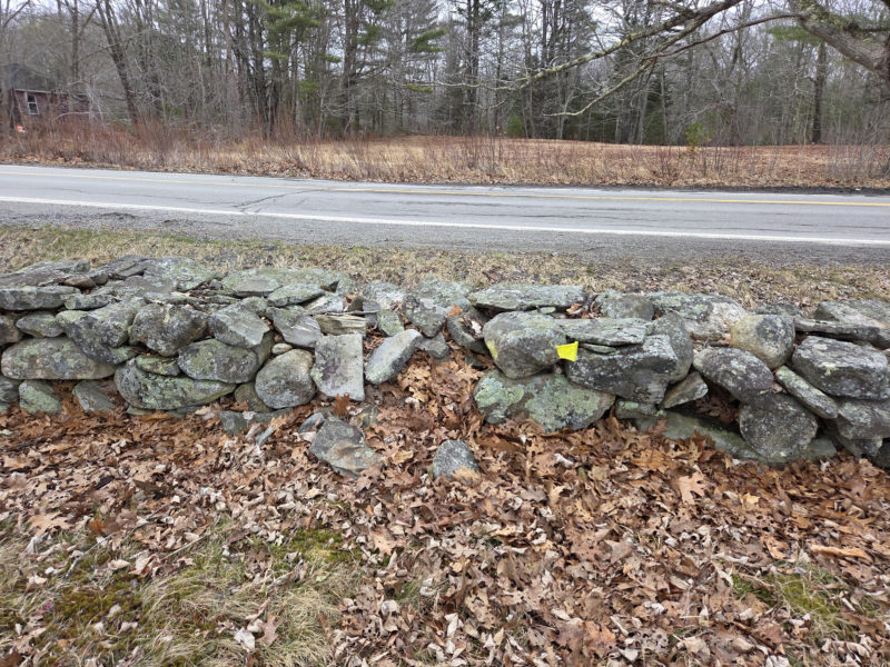 The before picture of the stone wall at the Chamberlain Cemetery. (Photo courtesy Lori Crook)