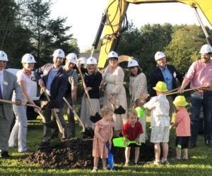 CLC YMCA staff and board members, joined by young attendees as well as representatives from the offices of U.S. Sens. Angus King and Susan Collins and U.S. Congresswoman Chellie Pingree, scoop shovels of dirt during a groundbreaking ceremony for Discovery Village at the CLC YMCA in Damariscotta on Wednesday, May 20. The new childcare facility will open on the grounds this fall to provide daycare and education for children up to 5 years old. (Sarah Masters photo)