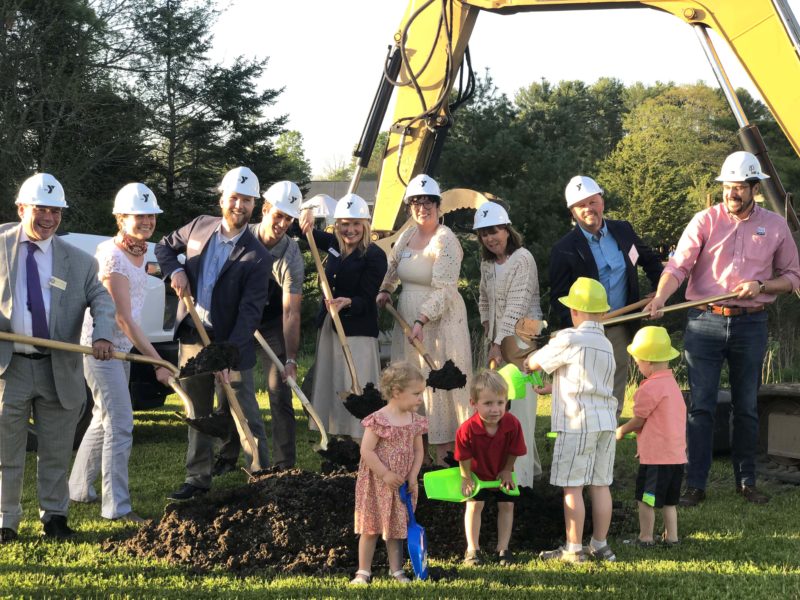 CLC YMCA staff and board members, joined by young attendees as well as representatives from the offices of U.S. Sens. Angus King and Susan Collins and U.S. Congresswoman Chellie Pingree, scoop shovels of dirt during a groundbreaking ceremony for Discovery Village at the CLC YMCA in Damariscotta on Wednesday, May 20. The new childcare facility will open on the grounds this fall to provide daycare and education for children up to 5 years old. (Sarah Masters photo)