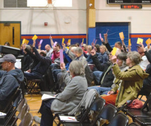 Bremen, Damariscotta, and Newcastle residents approve an article related to the RSU 48 budget during a meeting in the Great Salt Bay Consolidated School gym on Wednesday, May 13. (Emily Bracher photo)