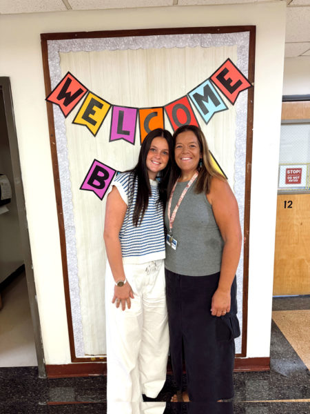 Abigail and Betsy Lash smile in one of the hallways of Miller School in Waldoboro. Abigail is wrapping up her first year teaching alongside her mother, who has been teaching there for over 20 years. (Photo courtesy Abigail Lash)