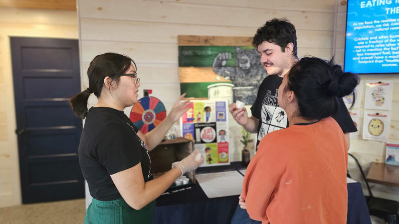 Attendees try a variety of packaged edible insect products from Entosense and participate in insect trivia at the 2025 Sustainable Supper with Edible Insects event. (Courtesy photo)