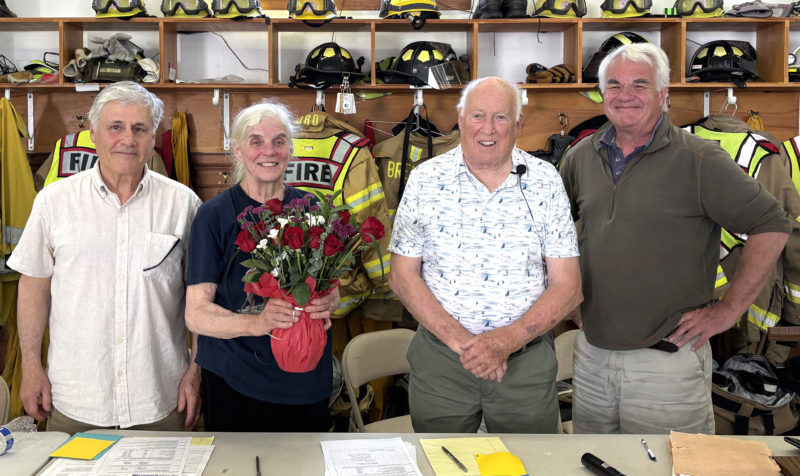 Bremen Select Board members Tom Papell and John Boe Marsh honor longtime annual town meeting moderator Don Means and outgoing board member Wendy Pieh on Saturday, June 13. The meeting was the last for Means and Pieh in their respective roles. From left: Tom Papell, Wendy Pieh, Don Means, and John Boe Marsh. (Emily Bracher photo)