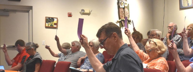 Damariscotta residents approve an article during the annual town meeting on Wednesday, June 10 at Skidompha Public Library. (Emily Bracher photo)