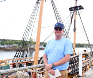 Eric Graves stands in front of the U.S. Brig Niagara at Sample's Shipyard in Boothbay Harbor. Graves and his team have been restoring the 20-gun warship for the past year. (Christine Simmonds photo)