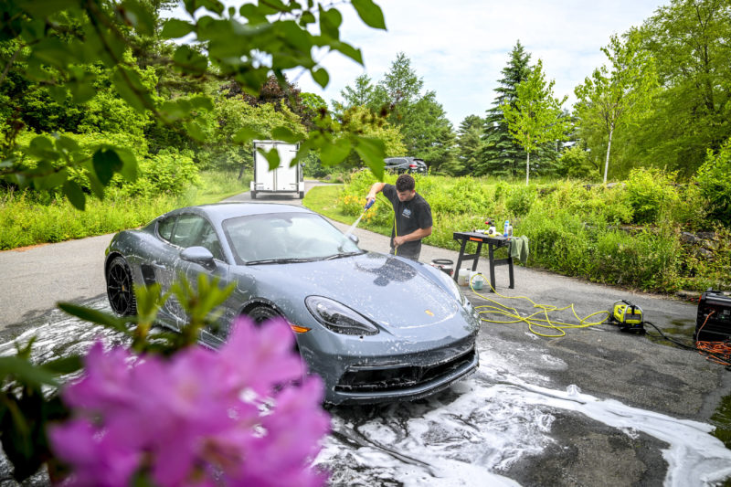 Jakobi Hagar washes a 2025 Vanadium Grey Metallic Porsche Cayman GTS 4.0 for a client of The Detail Dude, his mobile detailing business, in Newcastle on June 12. Hagar said hes not that much of a car enthusiast but he may still take his client up on an offer to teach him to drive a stick shift. (Bisi Cameron Yee photo)
