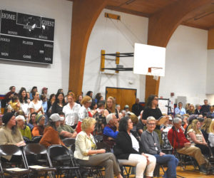 A line of community members of all ages wait to share personal stories and opinions during a forum to discuss MaineHealth Lincoln Hospital's labor and birth unit at Great Salt Bay Community School in Damariscotta on Tuesday, June 2. Hospital officials expect to make a decision about the future of the unit in by August. (Emily Bracher photo)