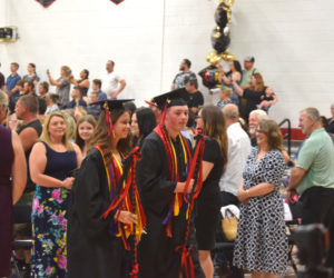 Wiscasset Middle High School valedictorian Olivia Marshall and salutatorian Noah Ruzyckij lead their class into the graduation ceremony on Thursday, June 4. Both students gave speeches during the ceremony. (Emily Bracher photo)