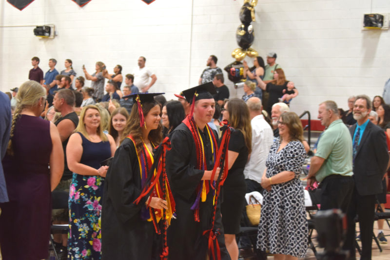 Wiscasset Middle High School valedictorian Olivia Marshall and salutatorian Noah Ruzyckij lead their class into the graduation ceremony on Thursday, June 4. Both students gave speeches during the ceremony. (Emily Bracher photo)