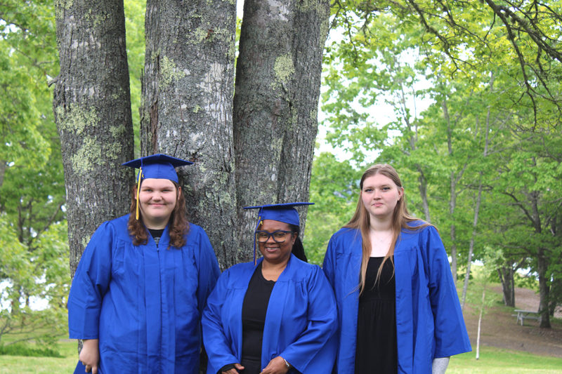 Boothbay-Wiscasset Regional Adult Education graduates Nevaeh Morin (left), Camla Dunbar (center), and Allyson Warren celebrate their achievement at Barrett Park on Saturday June 6. Not pictured: Anina Halter (Photo courtesy Rachelle Leonard)