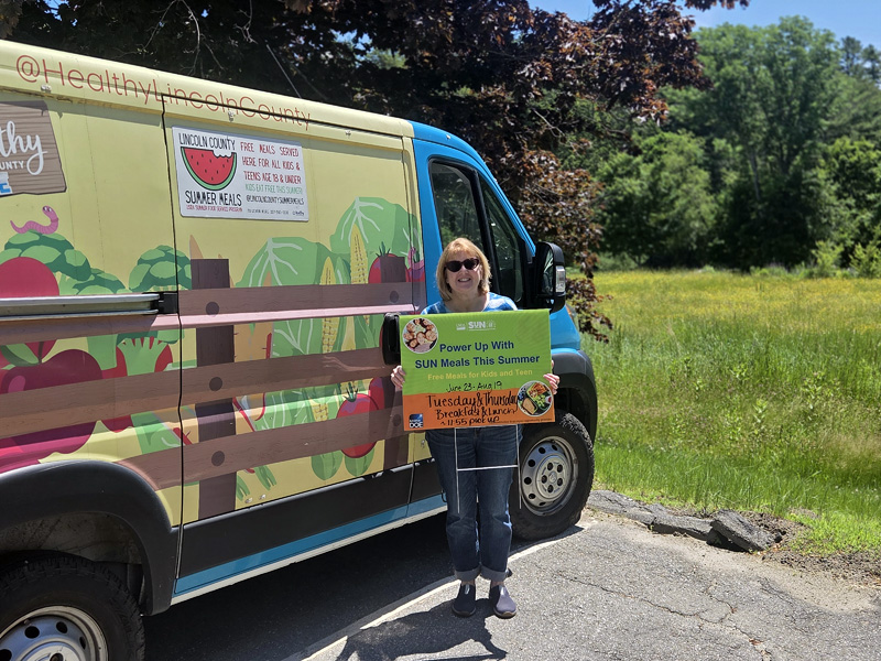 Healthy Lincoln County Summer Meals Coordinator Ellen Douglas with Lulu the Lunch Wagon, which has started to make the rounds through Lincoln County for the summer. (Photo courtesy Healthy Lincoln County)