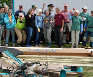 Community Cares Day volunteers strike a pose after completing some home improvement projects for a neighbor. (Photo courtesy Community Housing Improvement Project Inc.)