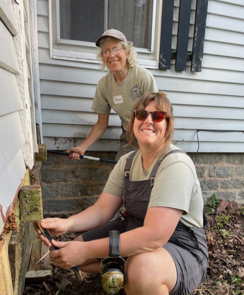 Sarah Highland and Bailey Romaine work on a project during Community Cares Day. (Photo courtesy Community Housing Improvement Project Inc.)
