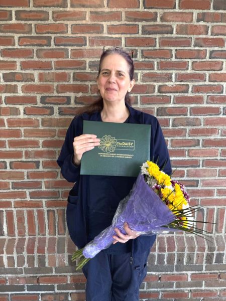 Trudy DeLong holds her DAISY Award. The award was created by the family of J. Patrick Barnes to thank nurses who make a meaningful difference in the lives of patients and families. (Photo courtesy MaineHealth)