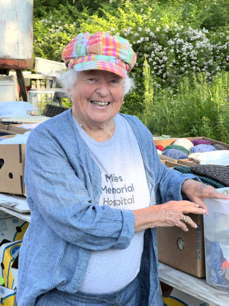 Miles Memorial Hospital Rummage Sale volunteer Mary Rand organizes donations. (Photo courtesy Miles Memorial Thrift Shop)
