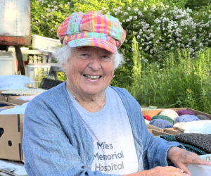 Miles Memorial Hospital Rummage Sale volunteer Mary Rand organizes donations. (Photo courtesy Miles Memorial Thrift Shop)