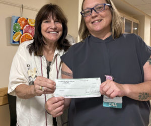 Shirley Gallagher Memorial Nursing Scholarship recipient Katrina Lanes (right) accepts her award from Miles Memorial Hospital League Thrift Store Manager Paula Romano. (Courtesy photo)