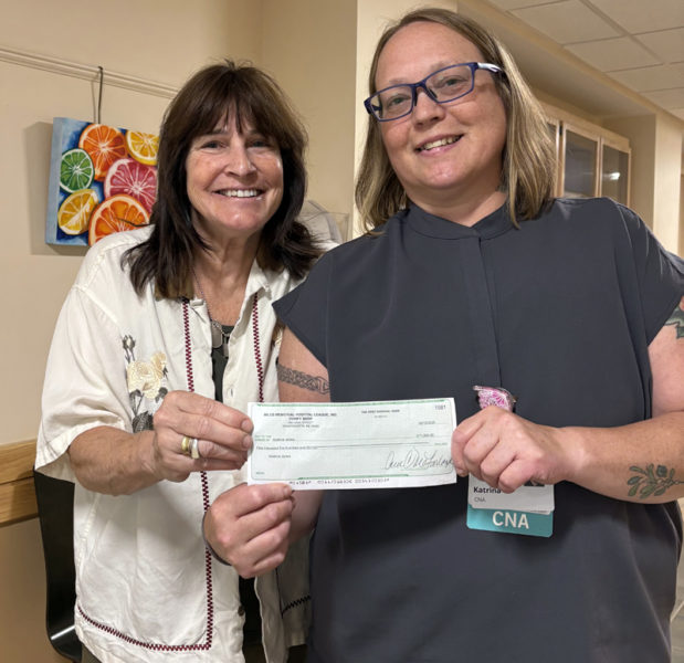 Shirley Gallagher Memorial Nursing Scholarship recipient Katrina Lanes (right) accepts her award from Miles Memorial Hospital League Thrift Store Manager Paula Romano. (Courtesy photo)